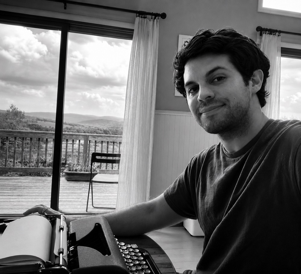 Michael Dean at a typewriter